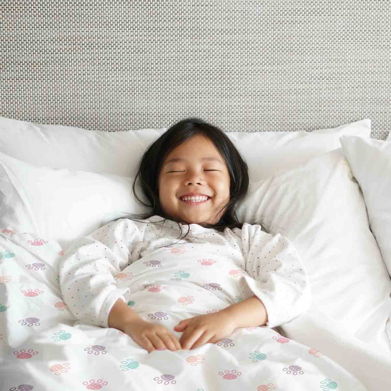 Therapy blanket and bedding set, white with colorful paws.