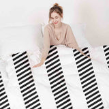 Therapy blanket and bedding set, grey with thick and thin stripes.