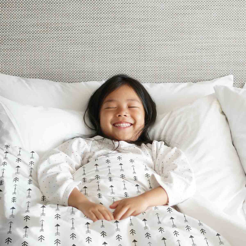 Therapy blanket and bedding set, white with many black arrows.