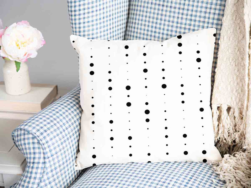 Almohada de salud blanca con puntos negros