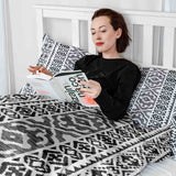 Set de ropa de cama con mantas terapéuticas y formas negras