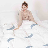 Therapy blanket and bedding set, white with blue waves.