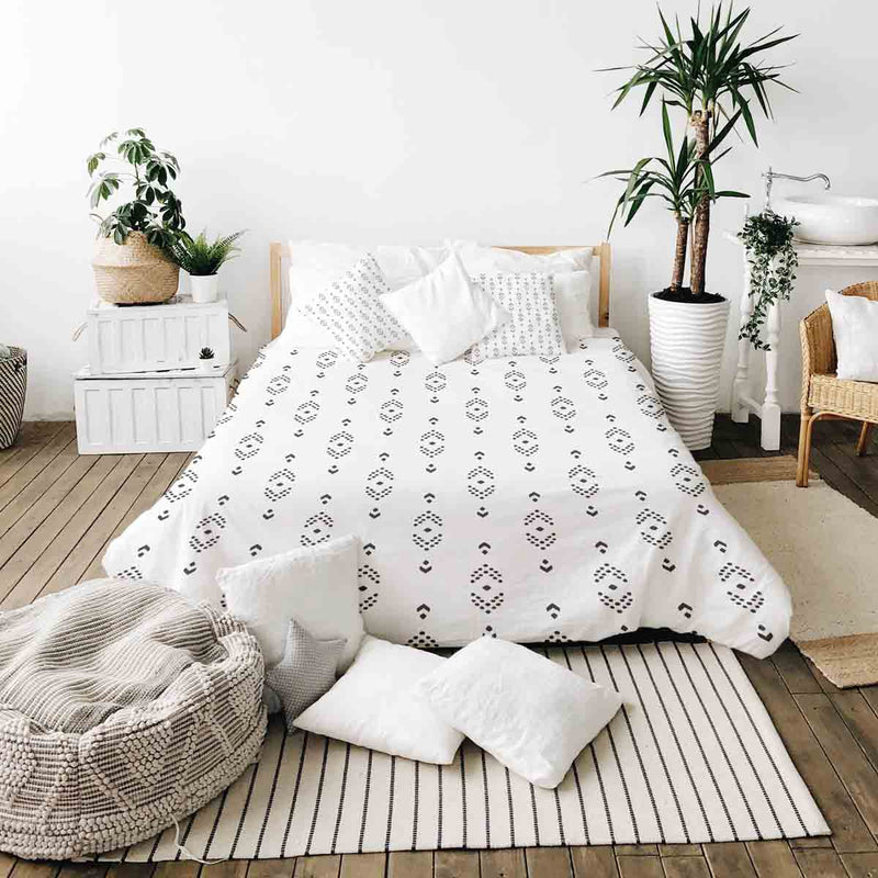 Therapy blanket and bedding set, white with black arrow pattern.