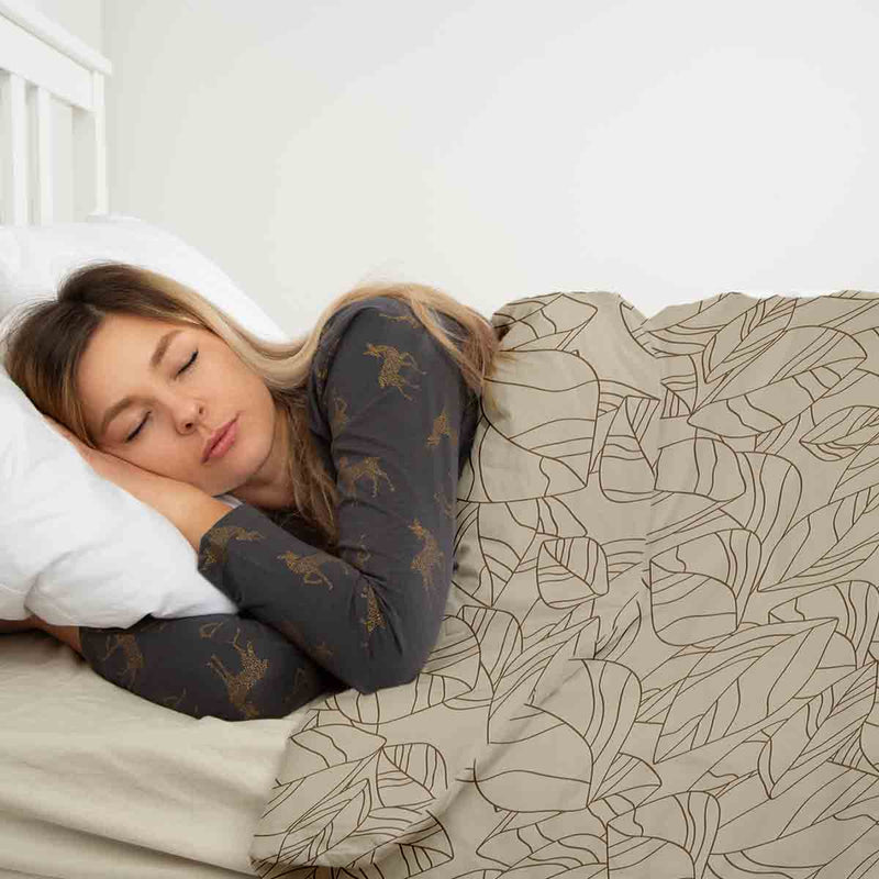 Therapy blanket bedding set, beige with black leaf pattern.