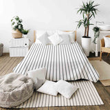 Therapy blanket bedding set, white with black stripes.
