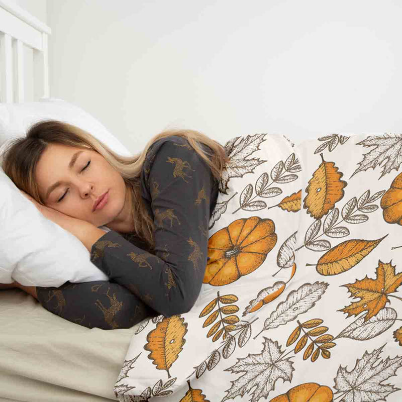 Therapy blanket bedding set, white with leaf and pumpkin pattern.