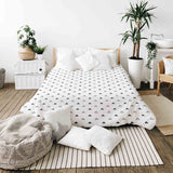 Therapy blanket and bedding set, white with black triangles.
