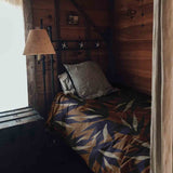 Therapy blanket and bedding set, brown with blue leaves.