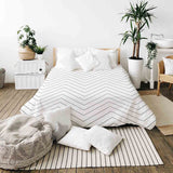 Therapy blanket bedding set, white with black zigzag pattern.